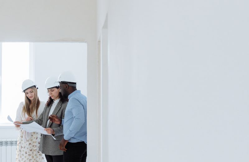 Electrician reviewing a home electrical system with a homeowner